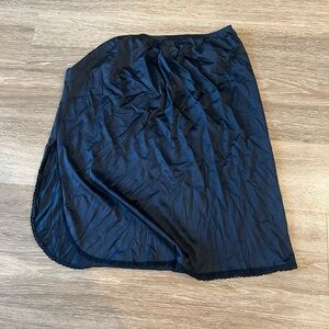 Black silk slip skirt with slit and lace fringe mid length